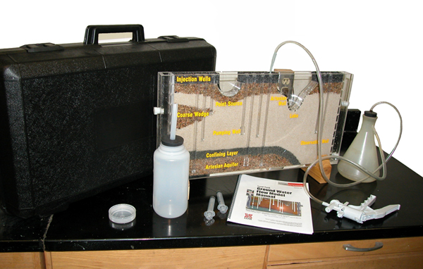 The University of Nebraska's Groundwater Flow Model is shipped in its carrying case, completely packed and ready to operate with the necessary accessories, including a hand-operated vacuum pump, flask to receive 