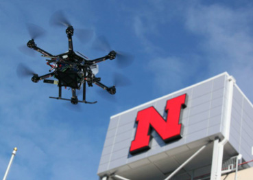 aerial robot flying next to Memorial Stadium