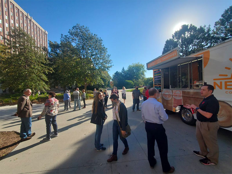 School of Computing Welcome (10-19-21): College of Engineering Faculty/Staff congregate around the New Day truck for coffee and smoothies.