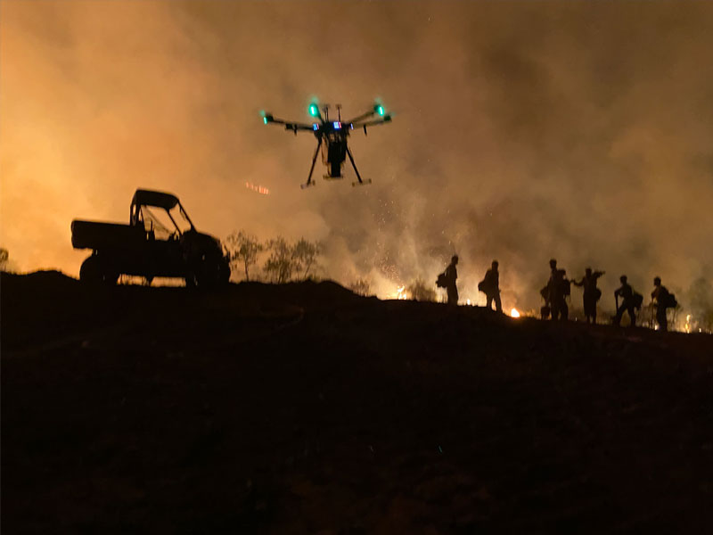 Drone flying over a blaze.