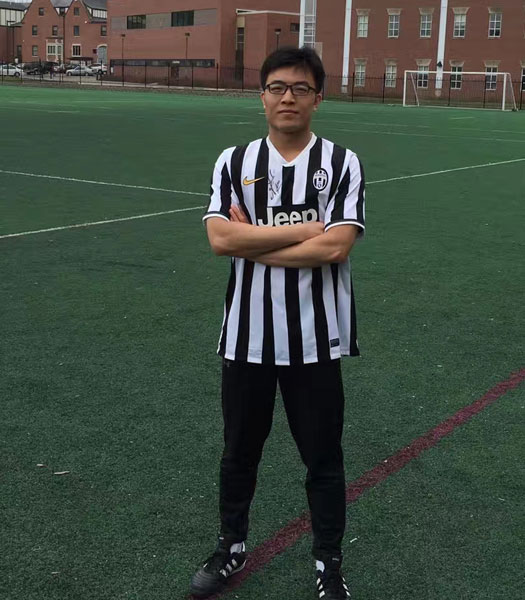 Chao Jia poses for a photo at the Mabel Lee fields wearing his soccer officiating outfit.