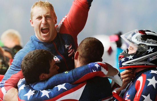 Curt Tomasevicz celebrates with other members of the USA Olympic four-man bobsled team after winning the silver medal in 2014.
