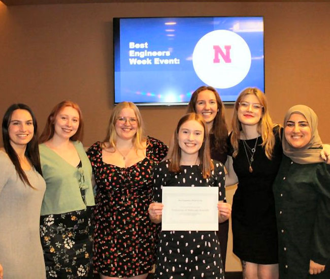 Members of the Engineering Student Advisory Board (eSAB) on City Campus in Lincoln and the Nebraska Engineering Student Council at Omaha (NESCO) on Scott Campus pose with their award for Best E-Week