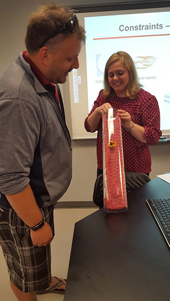 Dr. Iverson helps an instructor test his nanoparticle design during a BLAST training session.