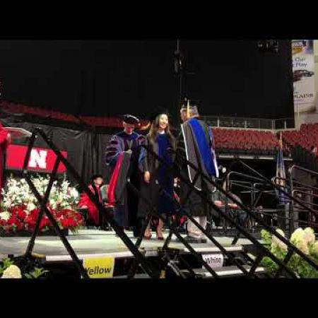 Video: Ying receives her diploma during the hooding ceremony