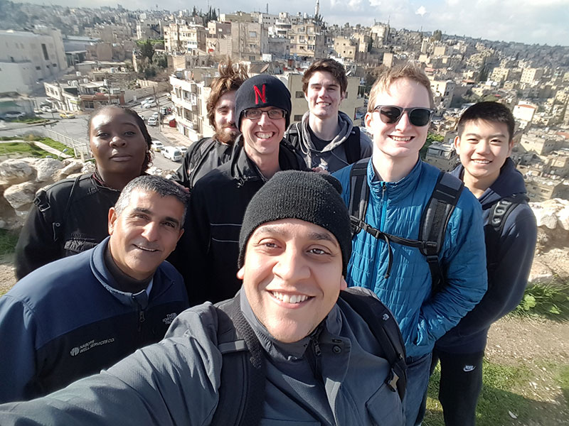 Dr. Tareq Daher and group smile for the camera in Jordan.