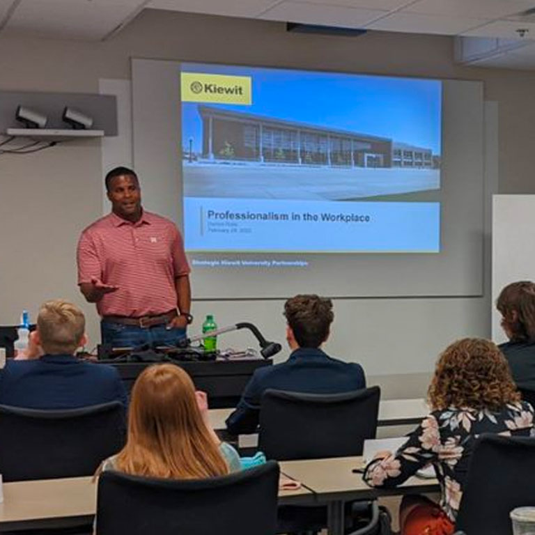 Darron Rolle of Kiewit speaks with students about professionalism in the workplace.