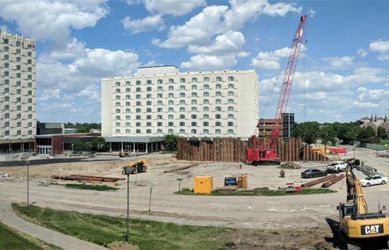 Piling has begun on the City Campus site for the new $97 million Kiewit Hall to help ensure a sturdier base for the project.