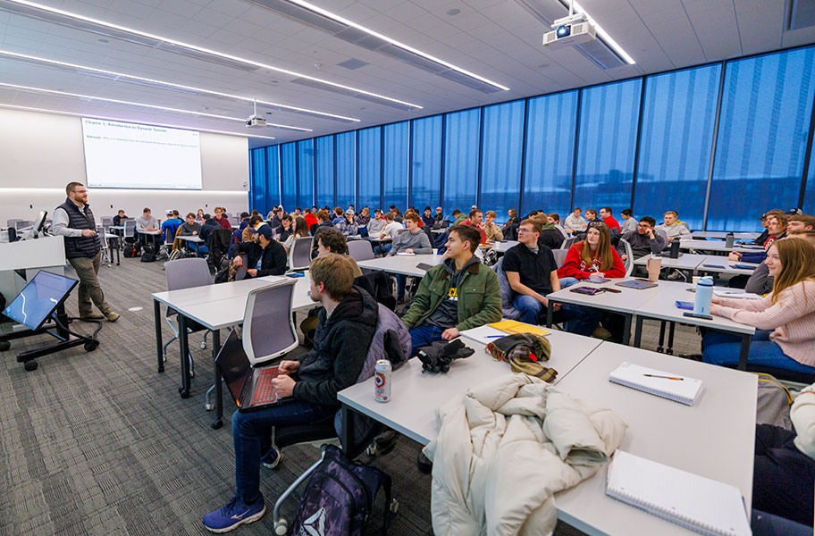 Students listening to an instructor inside a Kiewit Hall classroom