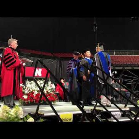 Video: Yao receives his diploma during the hooding ceremony