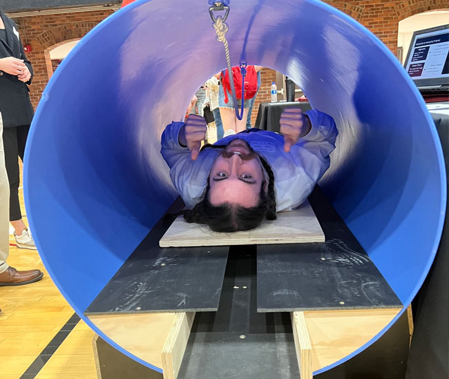 Man inside a tube as part of a SAC Museum exhibit