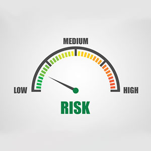Risk meter with an arrow pointing to low, medium and high