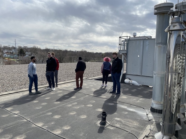 Students on roof with HVAC equipment