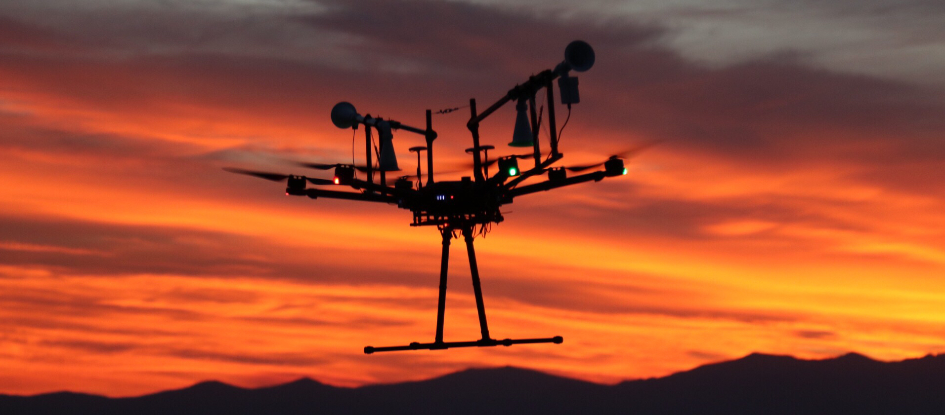 UAV taking air samples at sunset