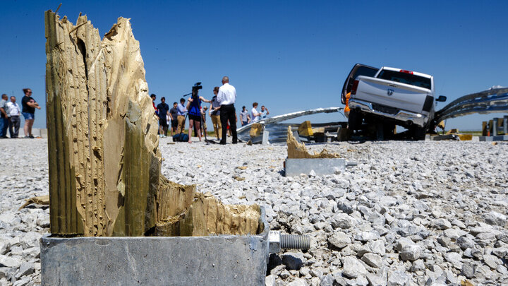 Debris and standing board after a truck and roadside impact.