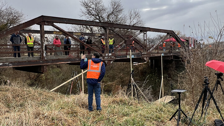 Daniel Linzell, Leslie D. Martin professor of civil and environmental engineering, explains the MADS-OPP system for bridge health monitoring to invited guests during a demonstration Thursday, October 27, on a decommissioned bridge in northwest Lancaster County.