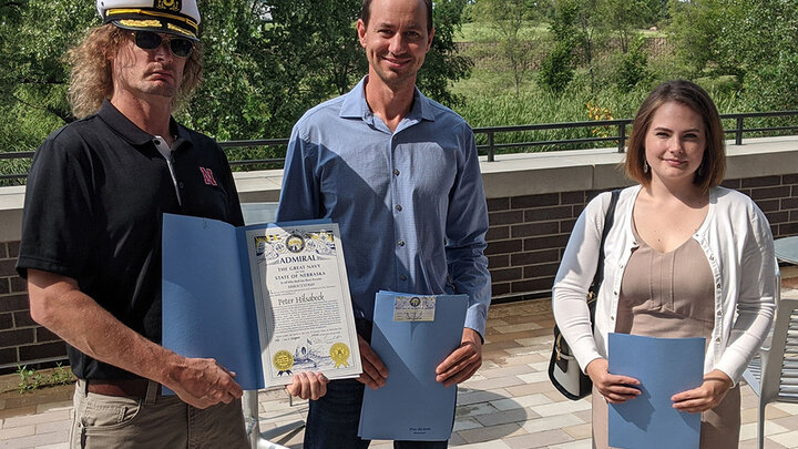 Five members of the College of Engineering community - including (from left) Peter Hilsabeck, Hunter Flodman and Heather Newell - were among the 11 from the University of Nebraska-Lincoln who were honored by the state on Aug. 30 for their roles in a collaboration that produced hand sanitizer for the state. Not pictured are Leonard Akert and Terry Howell Jr.