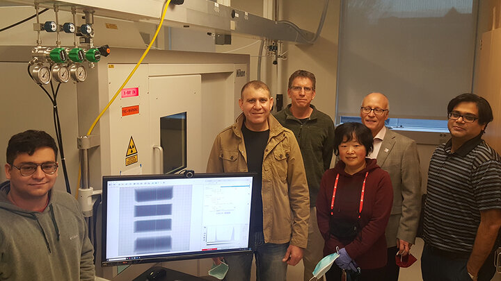 Andrew Menendez, Ziyad Smoqi, Jeff Shield, Wen Qian, Joseph Turner, Prahalada Rao – stand with the new Nikon X-Ray Computed Tomography machine