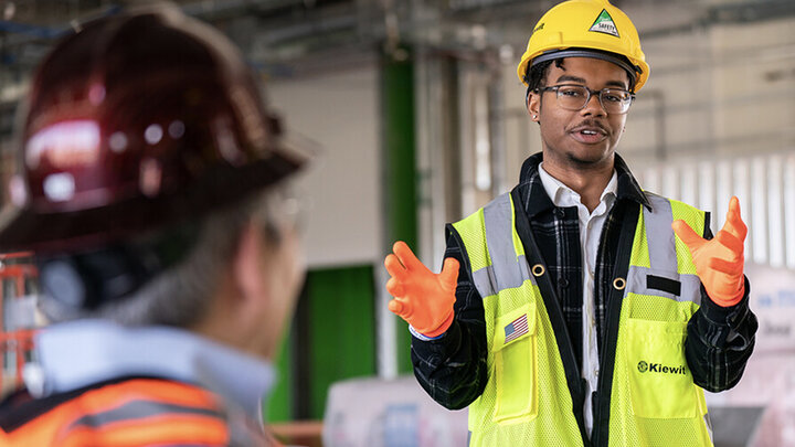 Nebraska's Andre Tharp III gestures as he talks with Dean Lance C. Pérez during a recent tour of Kiewit Hall construction.