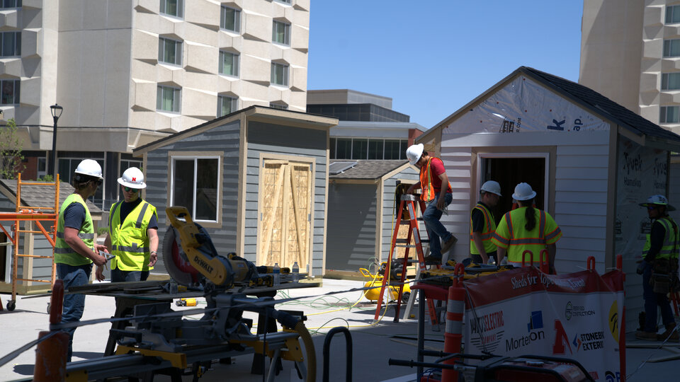 Construction students building sheds