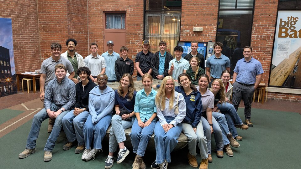 Group Photo of Students in Baseball Factory