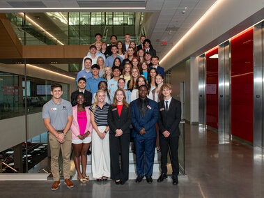 Kiewit Scholars at Banquet on staircase