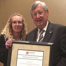 Roger Helgoth (right), a member of the College Advisory Board, receives the NCEES Central Zone Distinguished Service Award