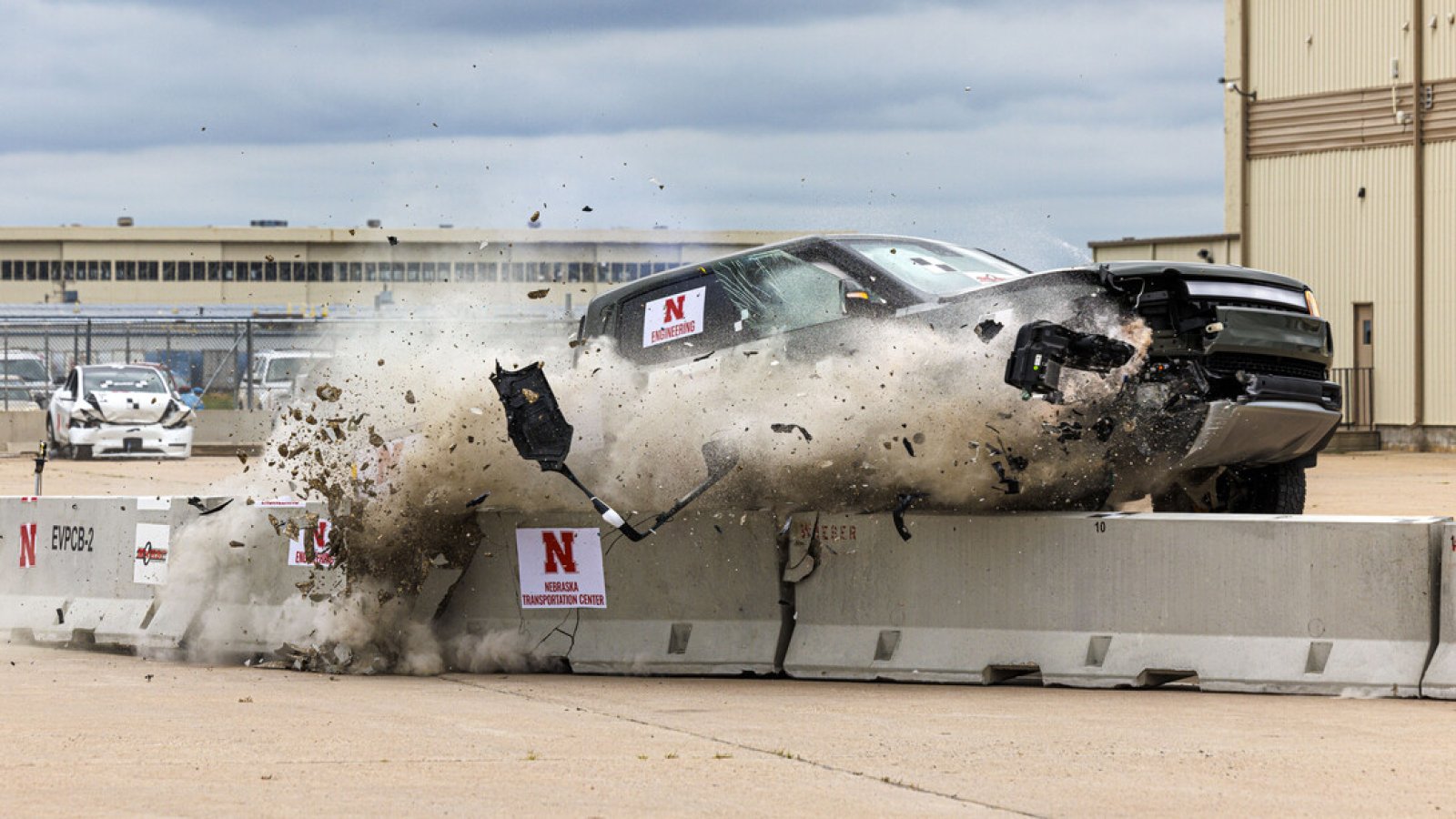 A Rivian R1T electric pickup crashes against a lane barrier during a July 1 crash test at the Midwest Roadside Safety Facility. (Craig Chandler / University Communication and Marketing)