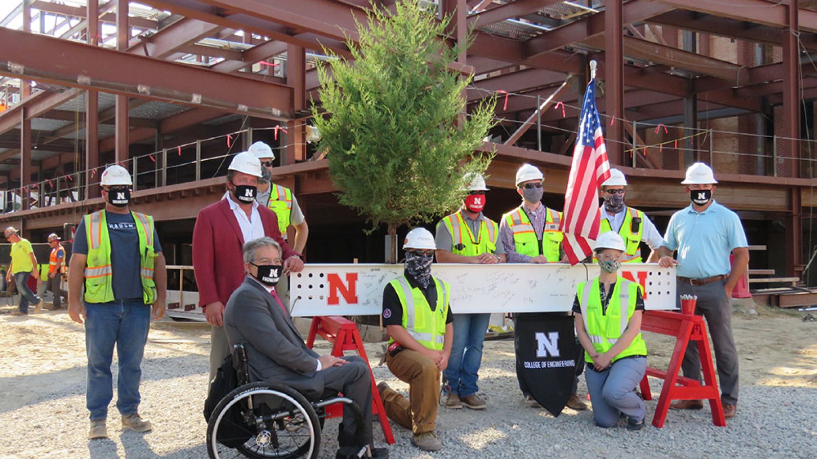 College of Engineering Dean Lance C. Pérez and representatives of Hausmann Construction were among the people who signed the final steel beam in the new Link before it was raised and put into place Wednesday, Aug. 26, 2020.