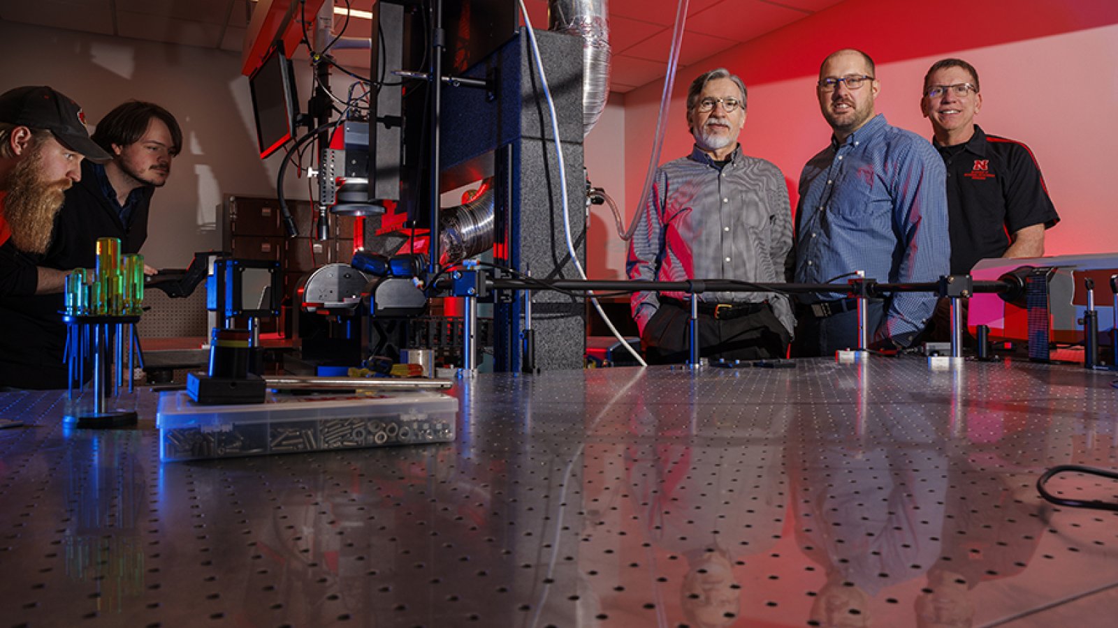 Nebraska researchers George Gogos (third from left), Craig Zhulke and Jeffrey Shield are part of a $9.2 million Department of Defense DARPA grant that could bring UNL up to $2.6 million for the team's research to develop stackable three-dimensional microchips with controllable hot spots to improve performance in future electronic architectures. (Craig Chandler / University Communication and Marketing)