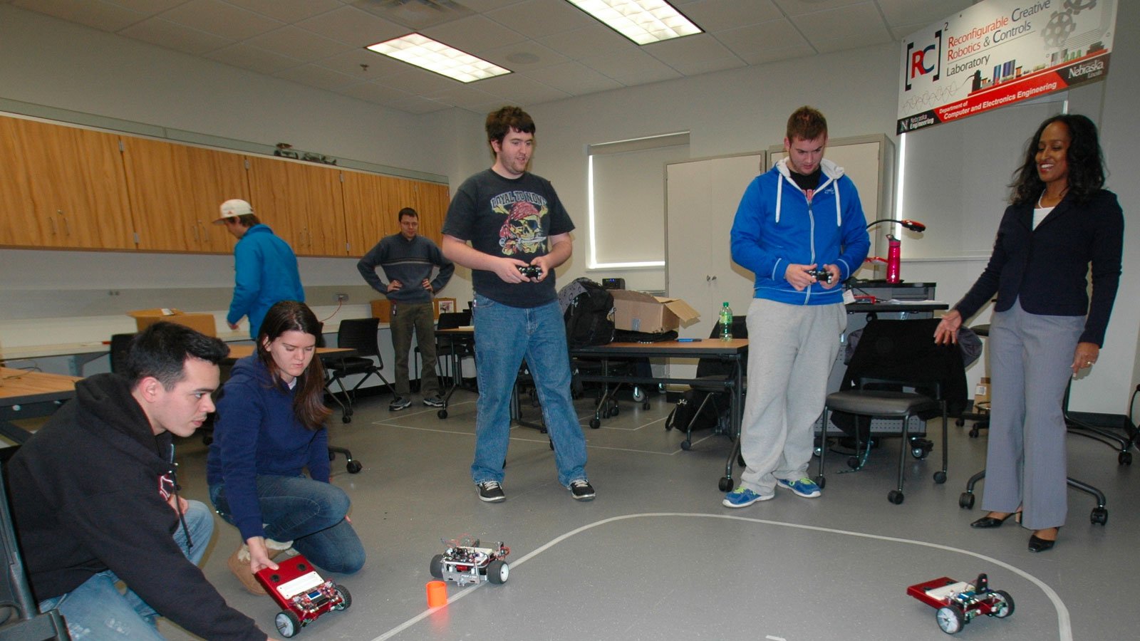 Students working with robotic vehicles