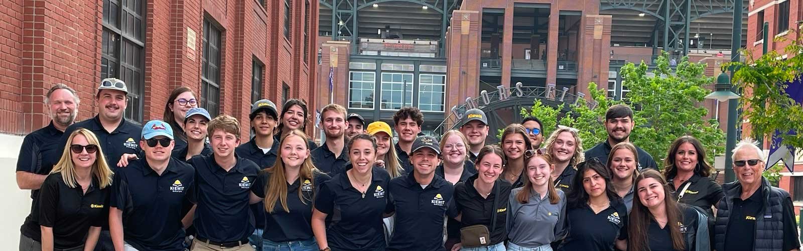 Scholars pose for a photo in front of Coors Field in Denver, CO.